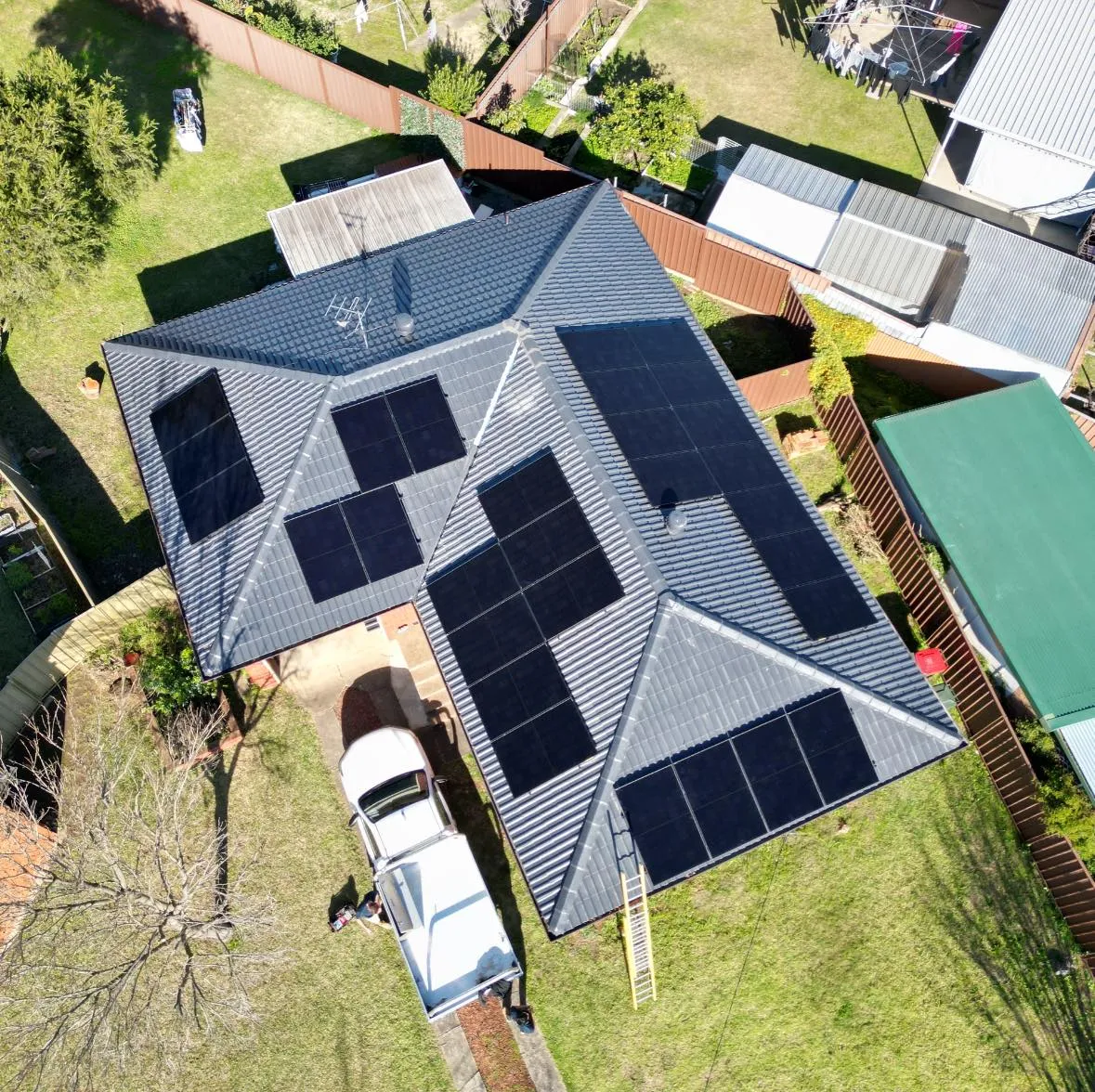 Aerial view of a home with a new rooftop solar system installed by Clean Earth Solar