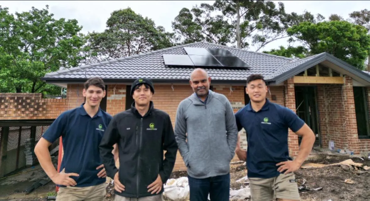 Technicians installing premium solar panels on roof